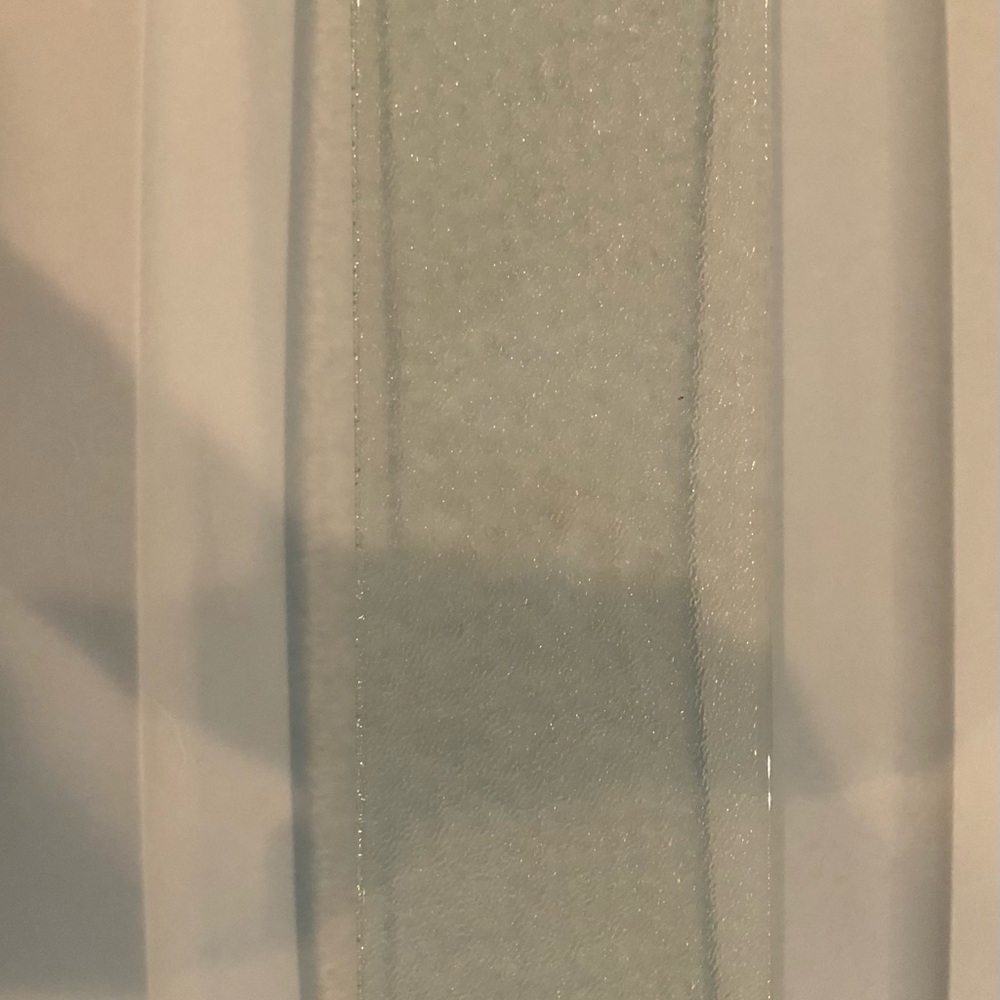 12 3/4 12/16 in long x 3 3/4 12/16 in deep Tempered glass Shelf a vanity cabinet
